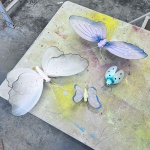 Set of 4 nylon animals. Butterflies and a beetle.